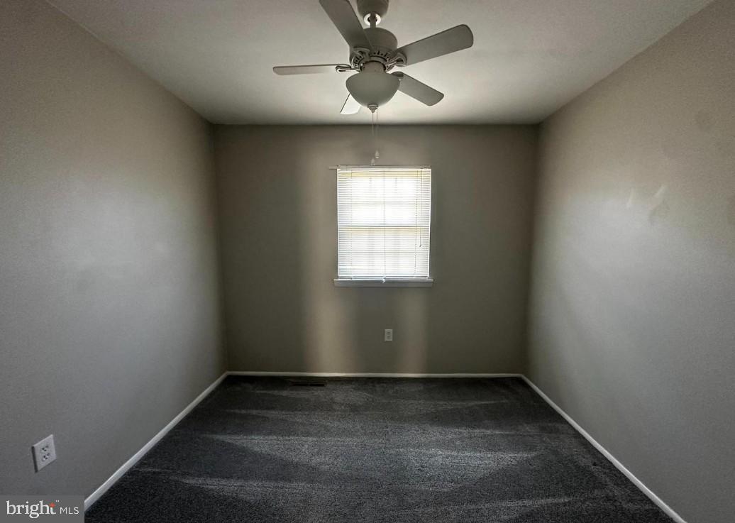 5651 Selford Road Halethorpe, MD 21227 - Photo 10 of 19 an empty room with a window and a fan