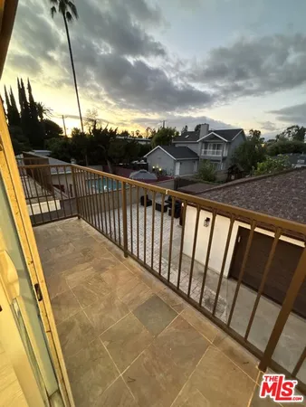 a view of balcony with furniture