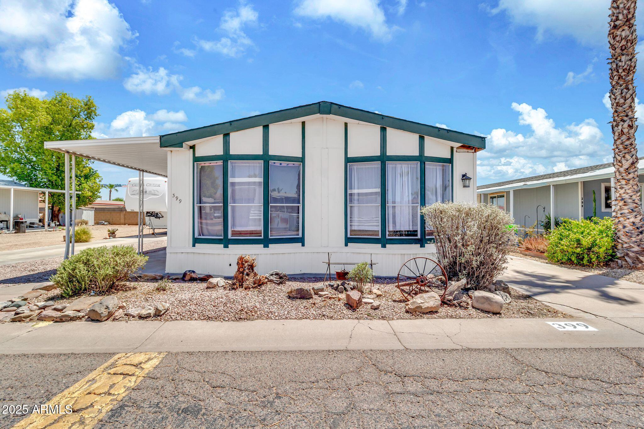 625 West McKellips Road, Unit 399 Mesa, AZ 85201 - Photo 1 of 31 a front view of a house