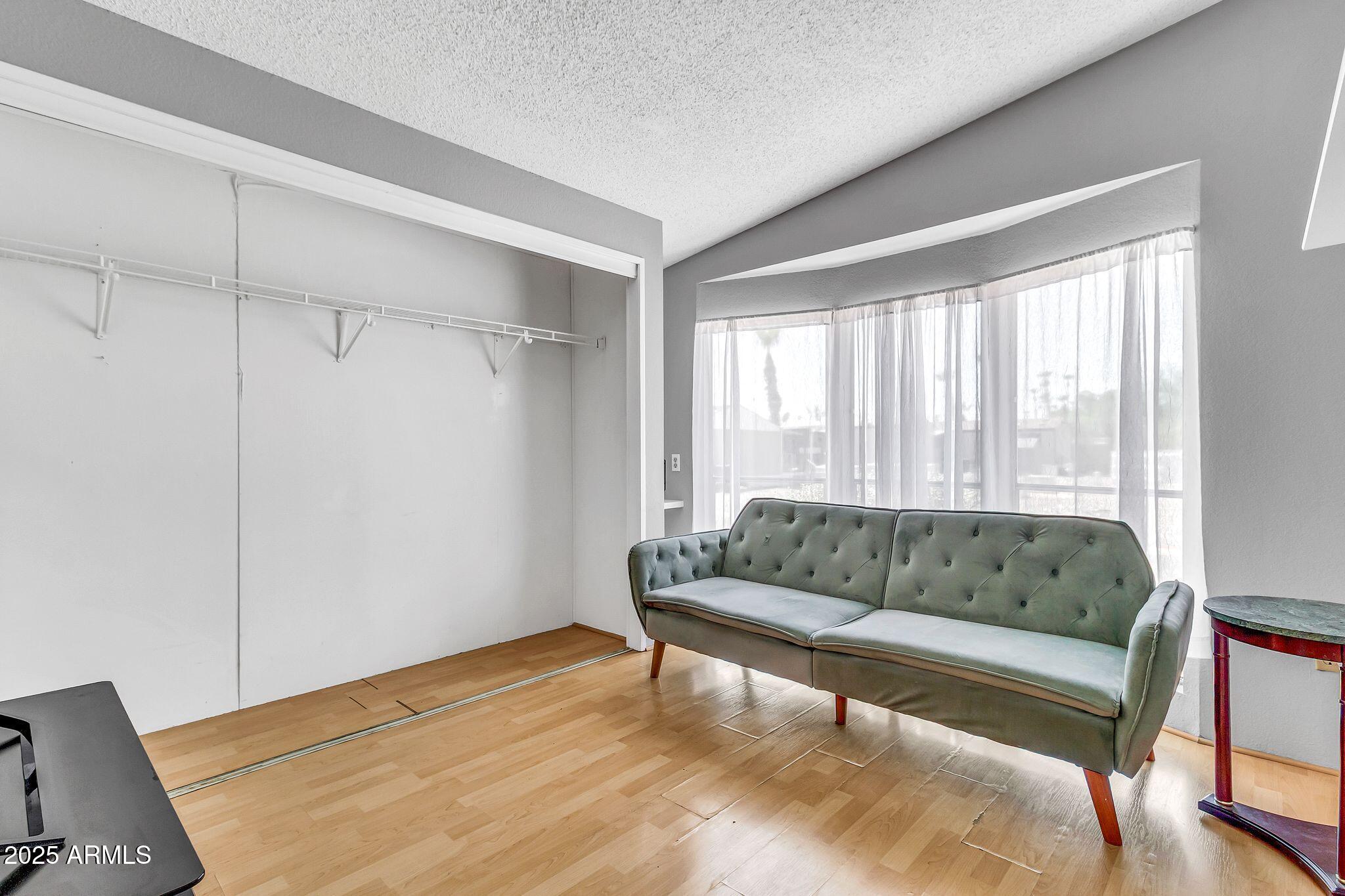 625 West McKellips Road, Unit 399 Mesa, AZ 85201 - Photo 10 of 31 a living room with furniture and a large window