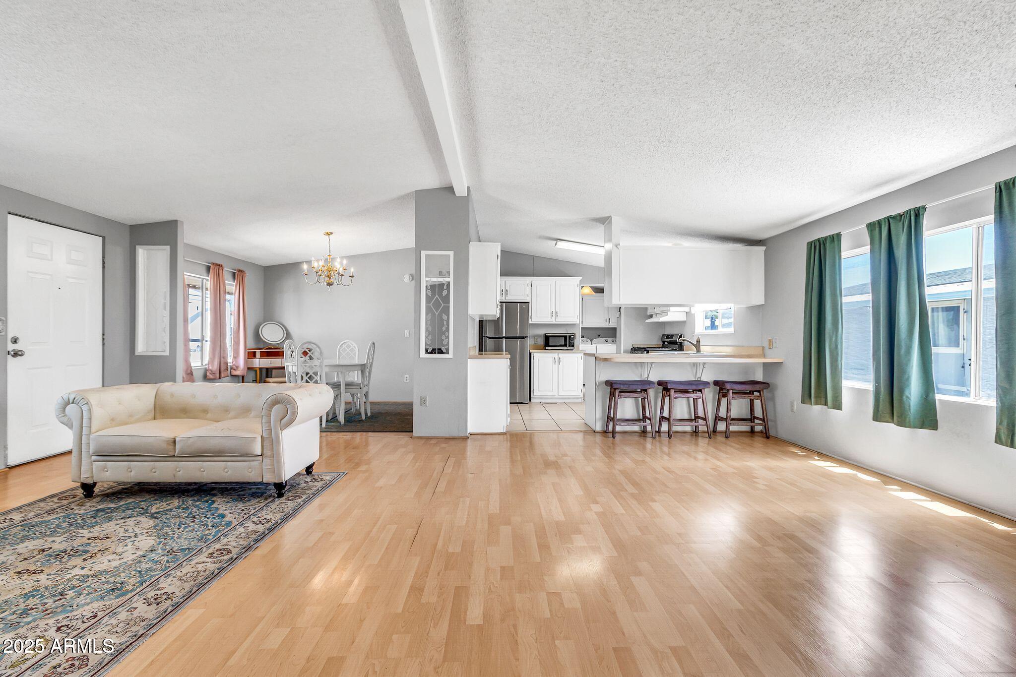 625 West McKellips Road, Unit 399 Mesa, AZ 85201 - Photo 11 of 31 a living room with furniture and a table