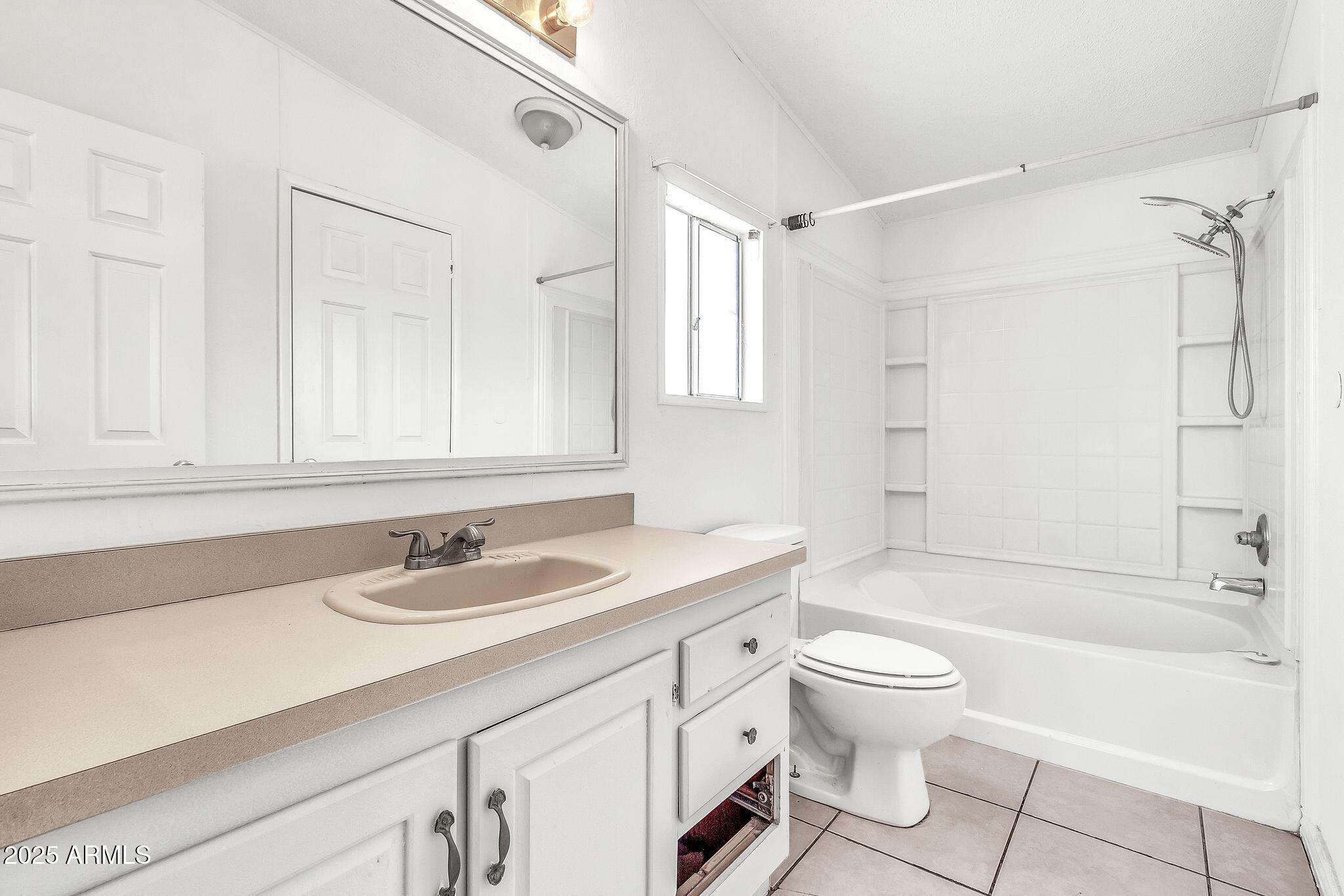 625 West McKellips Road, Unit 399 Mesa, AZ 85201 - Photo 15 of 31 a bathroom with a sink a toilet and a bathtub