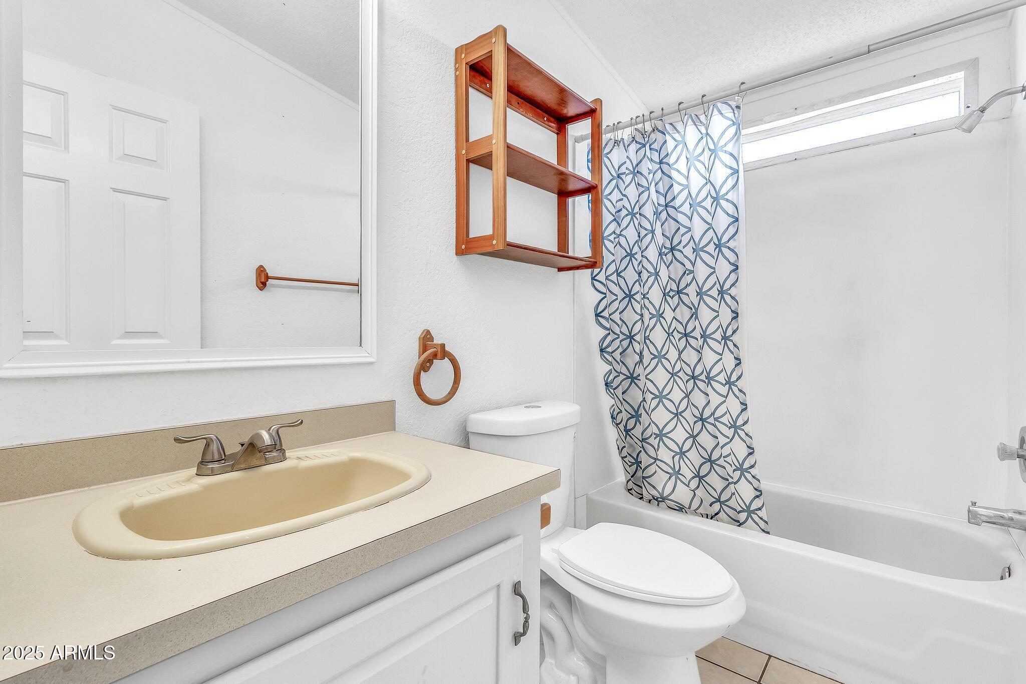 625 West McKellips Road, Unit 399 Mesa, AZ 85201 - Photo 20 of 31 a bathroom with a sink toilet and shower
