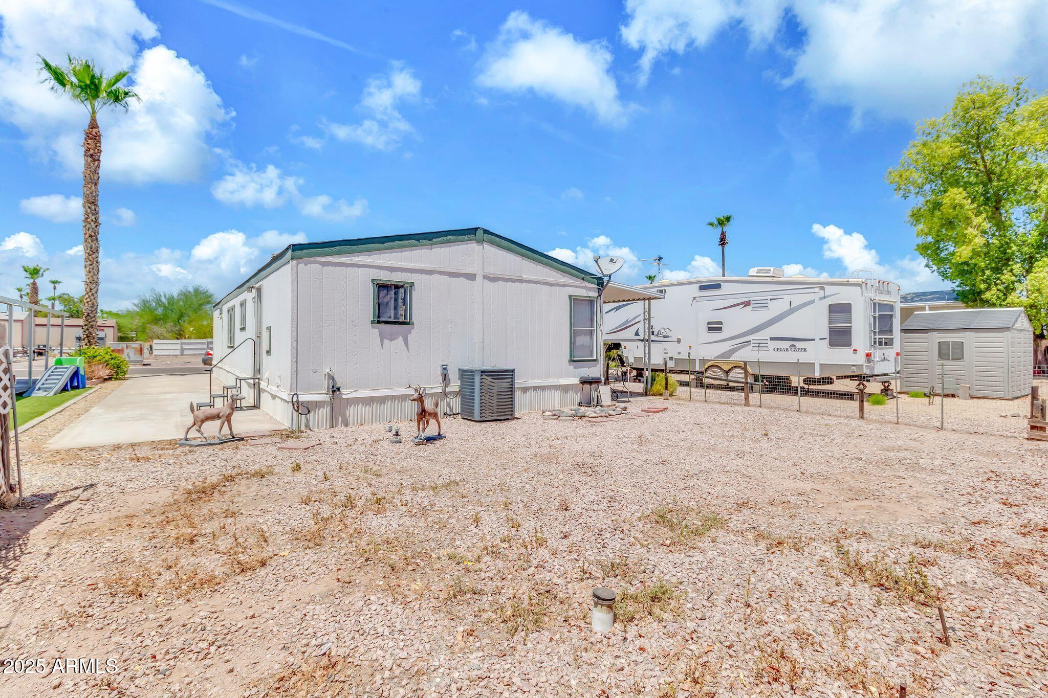 625 West McKellips Road, Unit 399 Mesa, AZ 85201 - Photo 23 of 31 a view of back yard of the house