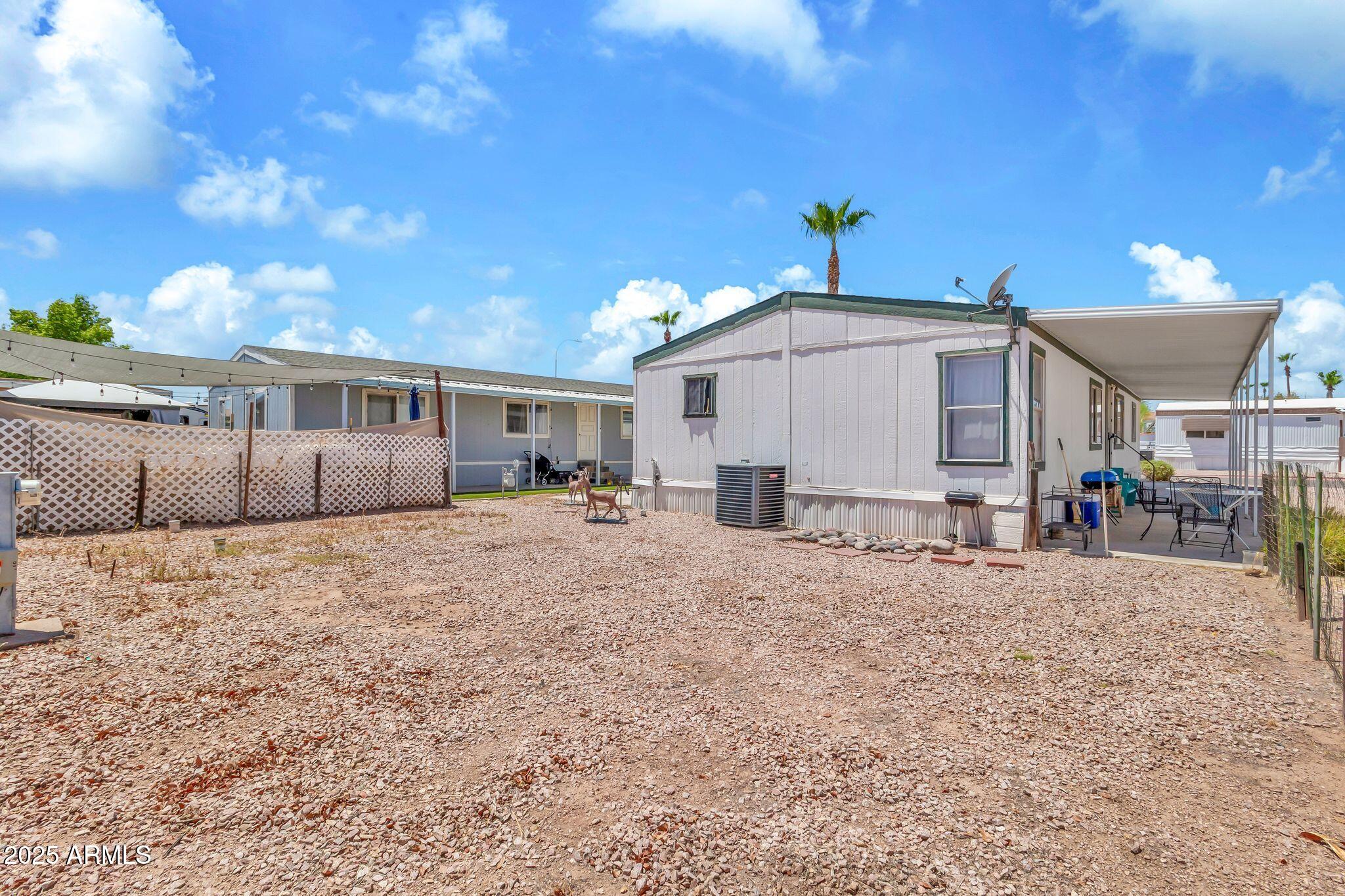 625 West McKellips Road, Unit 399 Mesa, AZ 85201 - Photo 24 of 31 a view of a house with a patio