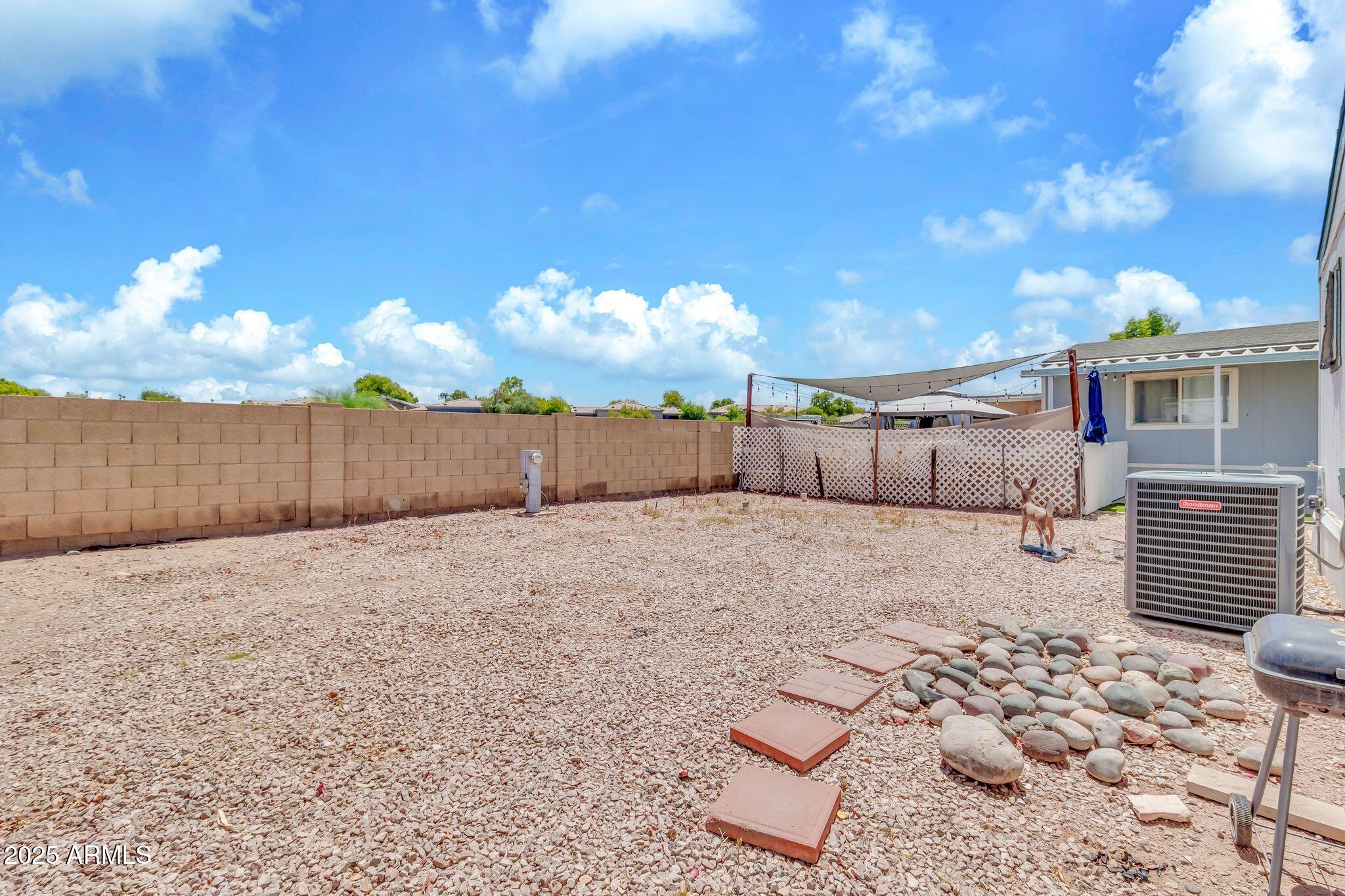 625 West McKellips Road, Unit 399 Mesa, AZ 85201 - Photo 25 of 31 a view of a backyard