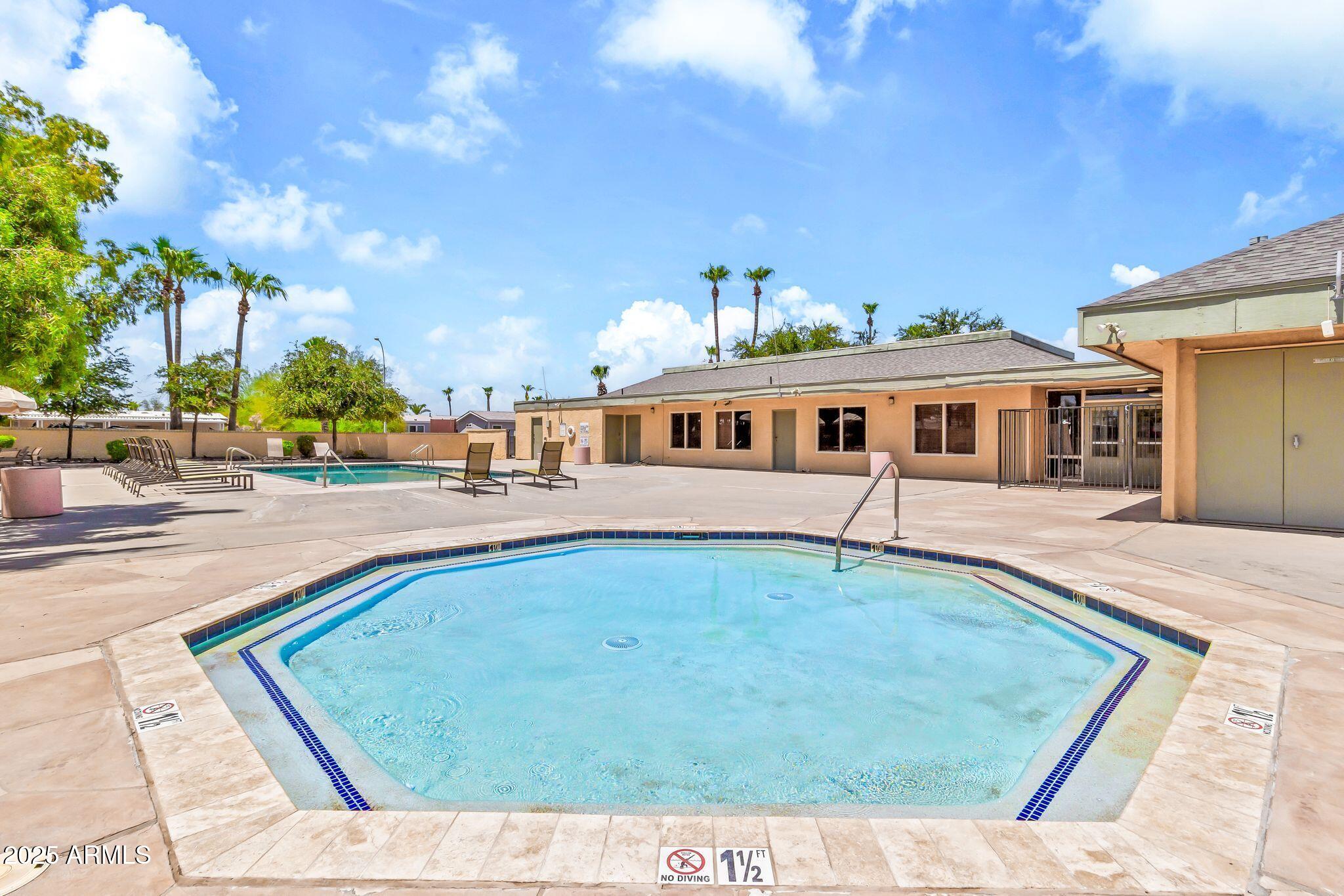 625 West McKellips Road, Unit 399 Mesa, AZ 85201 - Photo 27 of 31 a view of a house with swimming pool