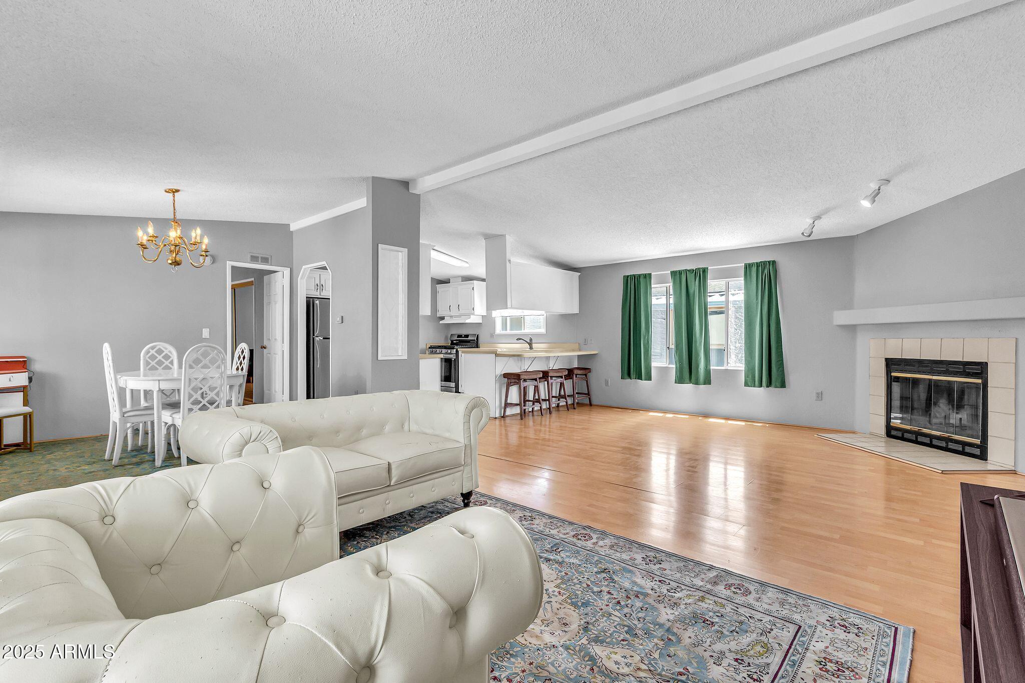 625 West McKellips Road, Unit 399 Mesa, AZ 85201 - Photo 6 of 31 a living room with furniture and a fireplace