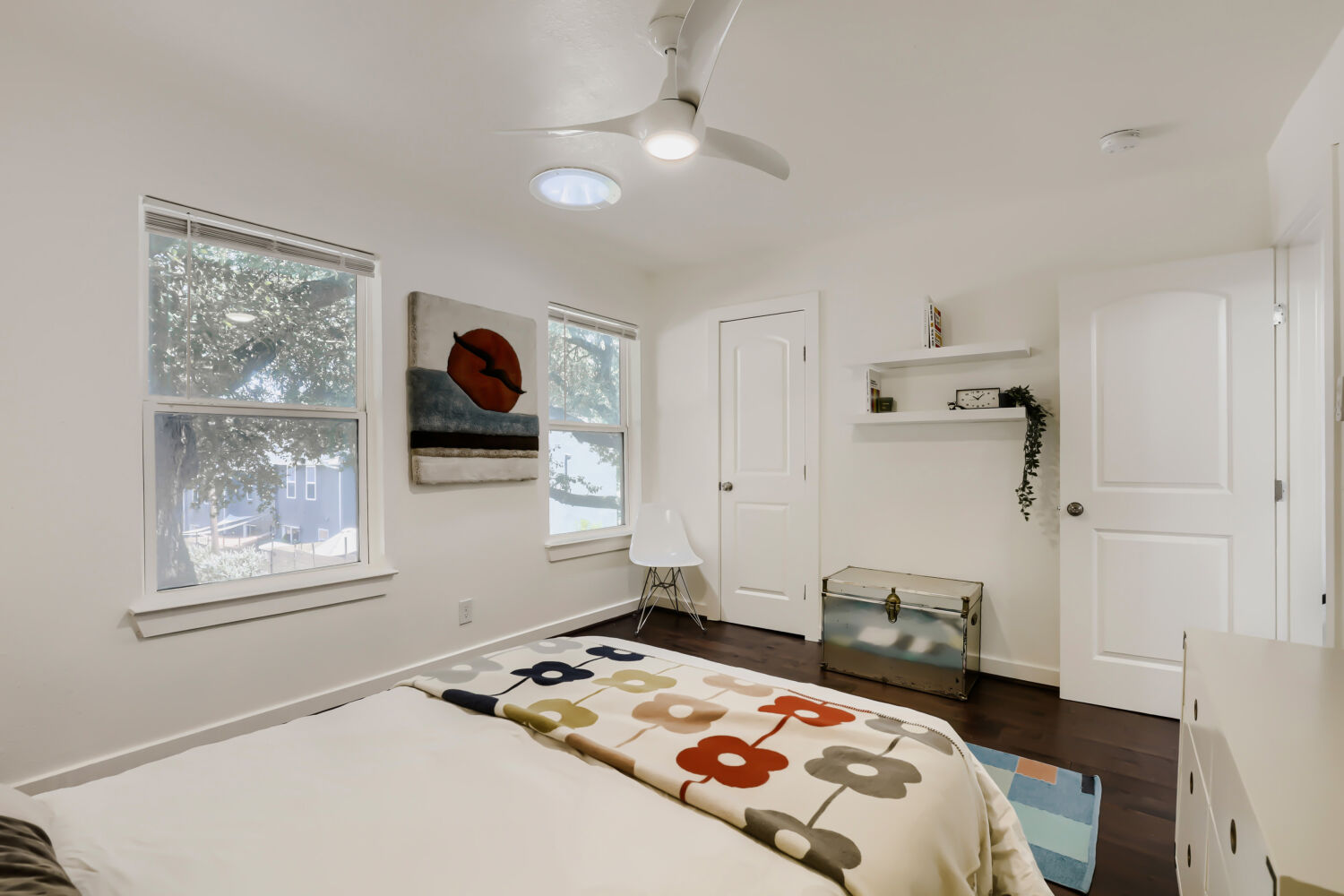 6211 Manor Road, Unit 105 Austin, TX 78723 - Photo 14 of 18 Well-lit sleeping quarters with wood flooring and ample windows and closet.