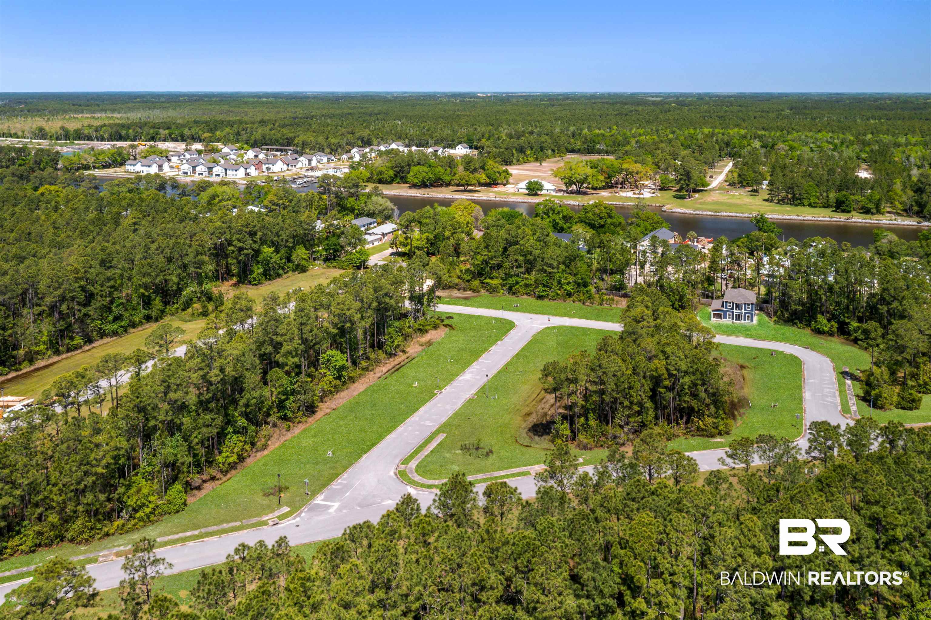 657 Island Way Gulf Shores, AL 36542 - Photo 40 of 59 Drone / aerial view featuring a water view and a view of trees