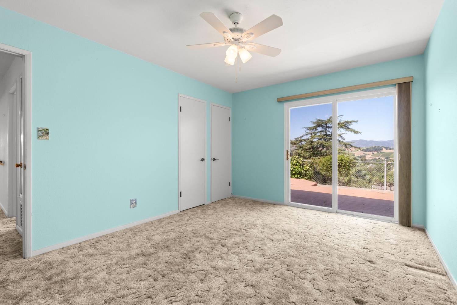 25 Hill Street Oak View, CA 93022 - Photo 8 of 16 an empty room with windows and fan