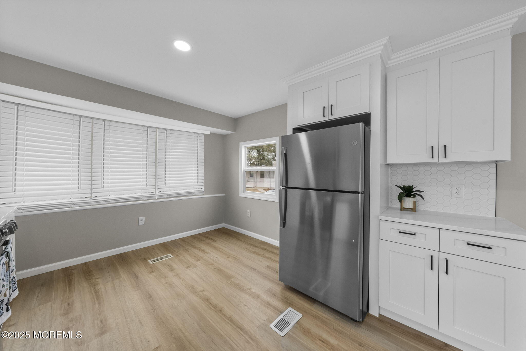 712 7th Street Jackson, NJ 08527 - Photo 11 of 37 a kitchen with stainless steel appliances a refrigerator sink and cabinets