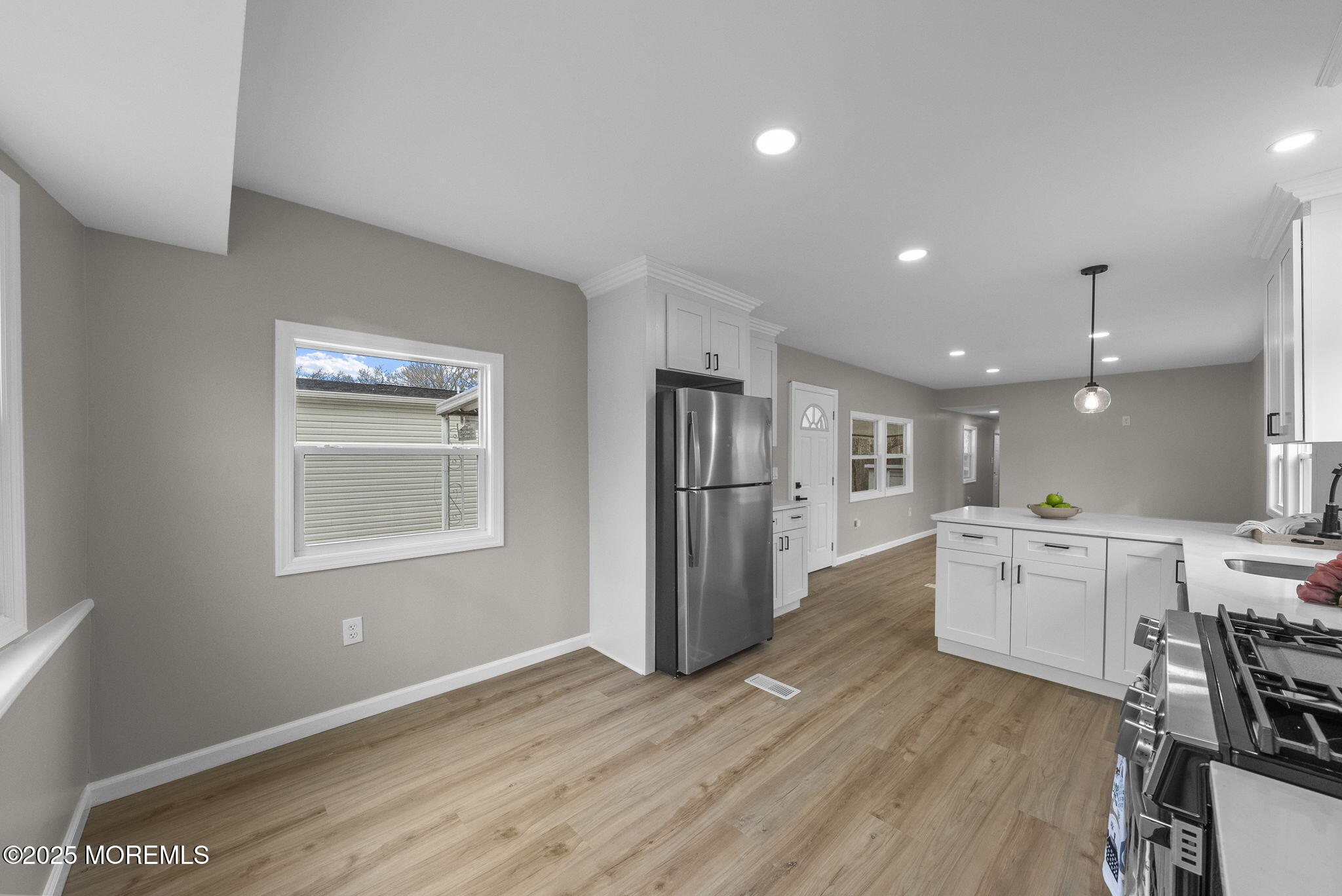 712 7th Street Jackson, NJ 08527 - Photo 12 of 37 a kitchen with a refrigerator and a stove top oven
