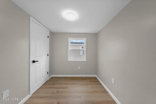 a bathroom with a sink mirror and vanity
