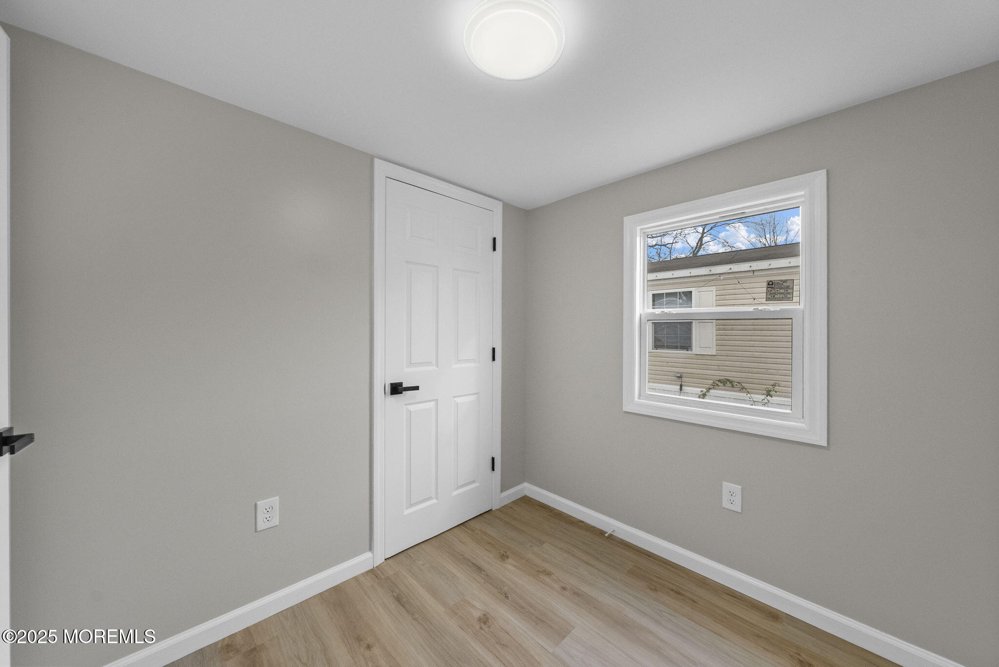 712 7th Street Jackson, NJ 08527 - Photo 18 of 37 a view of an empty room with closet and a window