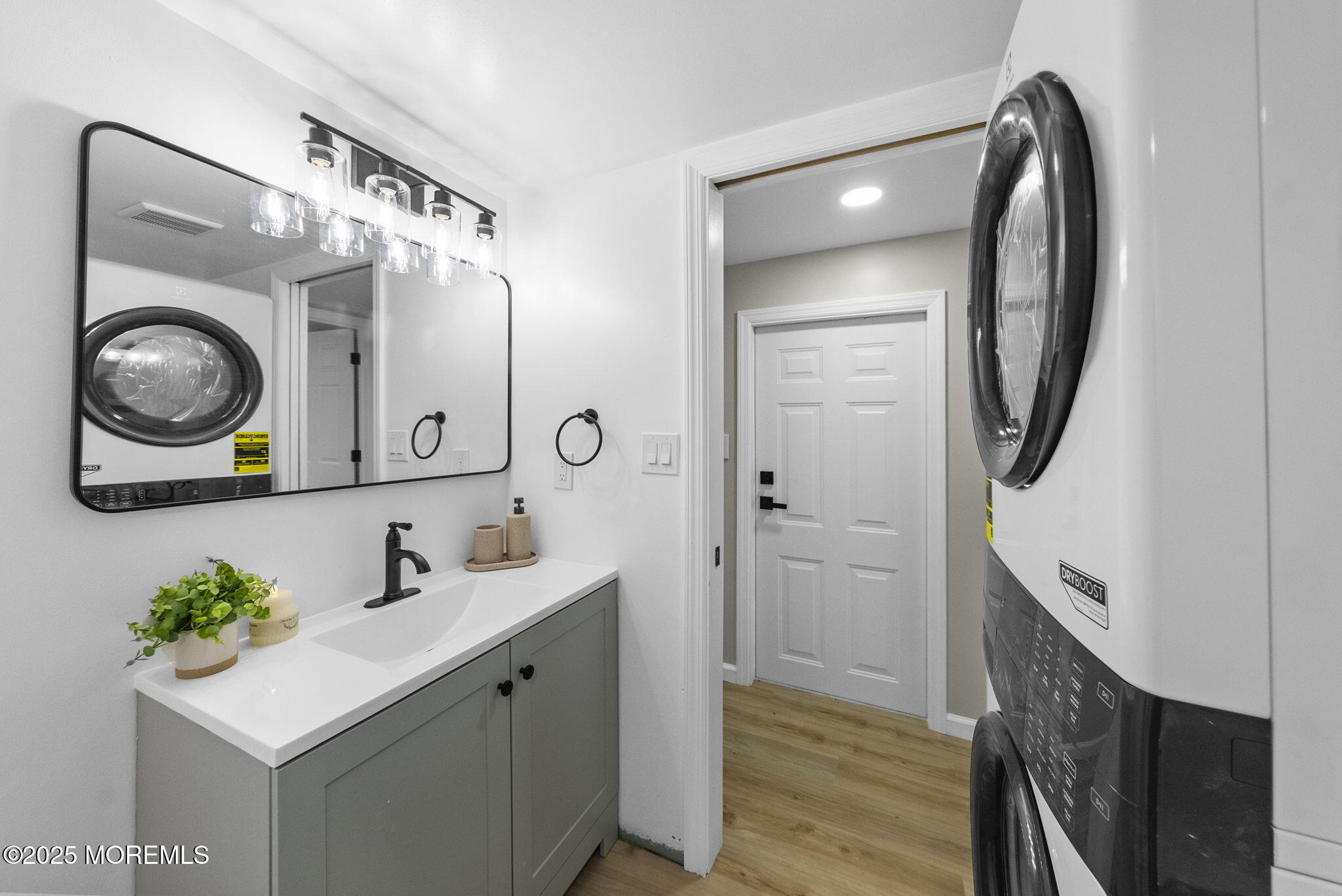 712 7th Street Jackson, NJ 08527 - Photo 19 of 37 a bathroom with a sink mirror and vanity