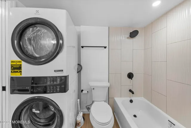 a bathroom with a bathtub a sink and a mirror