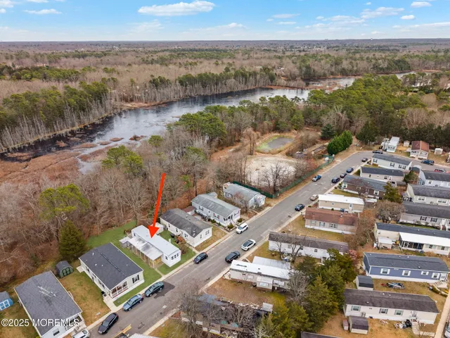 a view of a house with a yard and a garden
