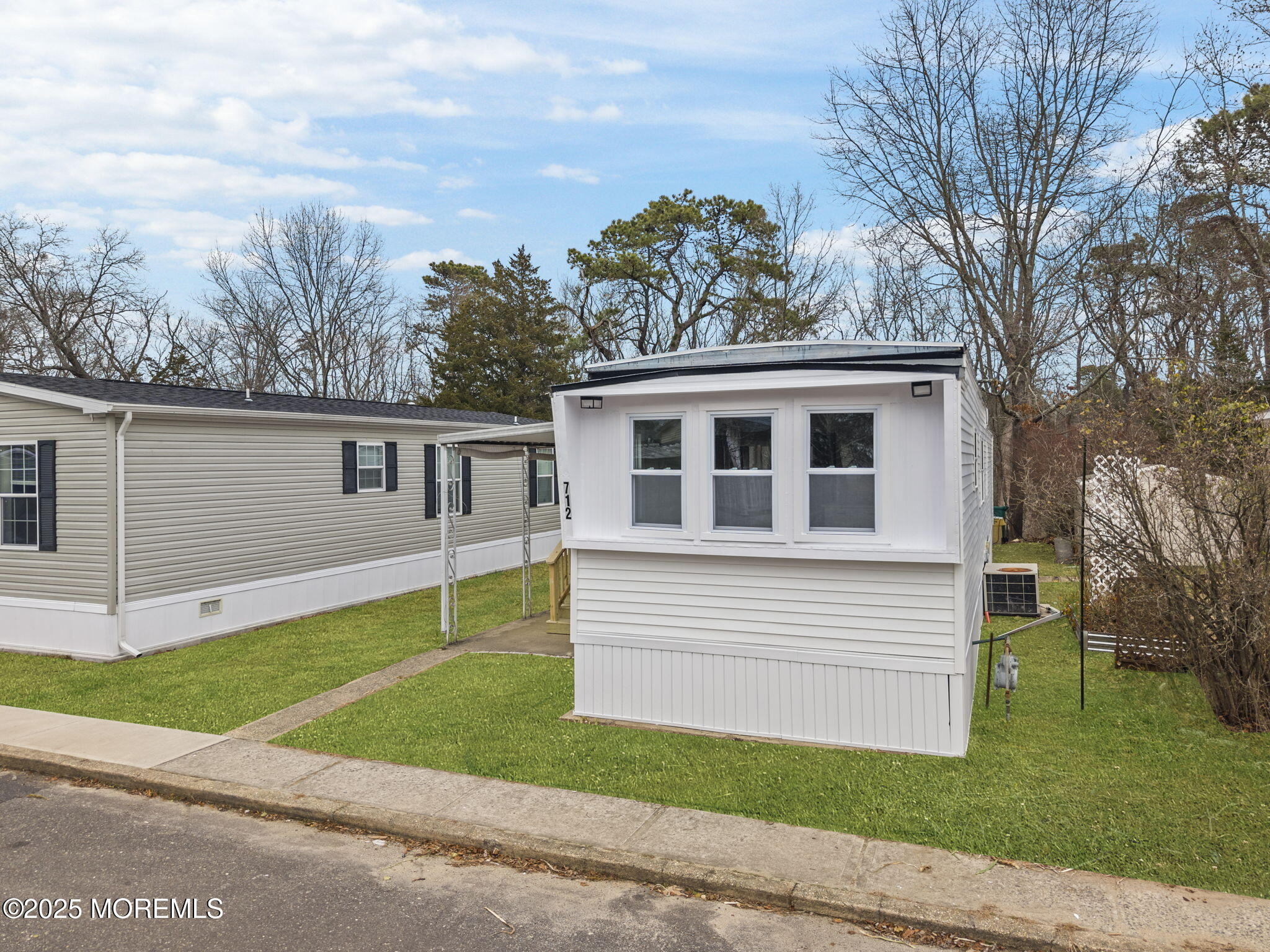 712 7th Street Jackson, NJ 08527 - Photo 32 of 37 a view of house with a yard