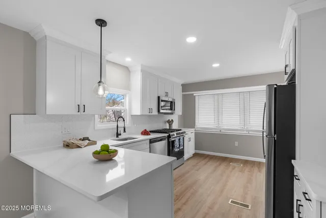 a kitchen with a stove and a microwave