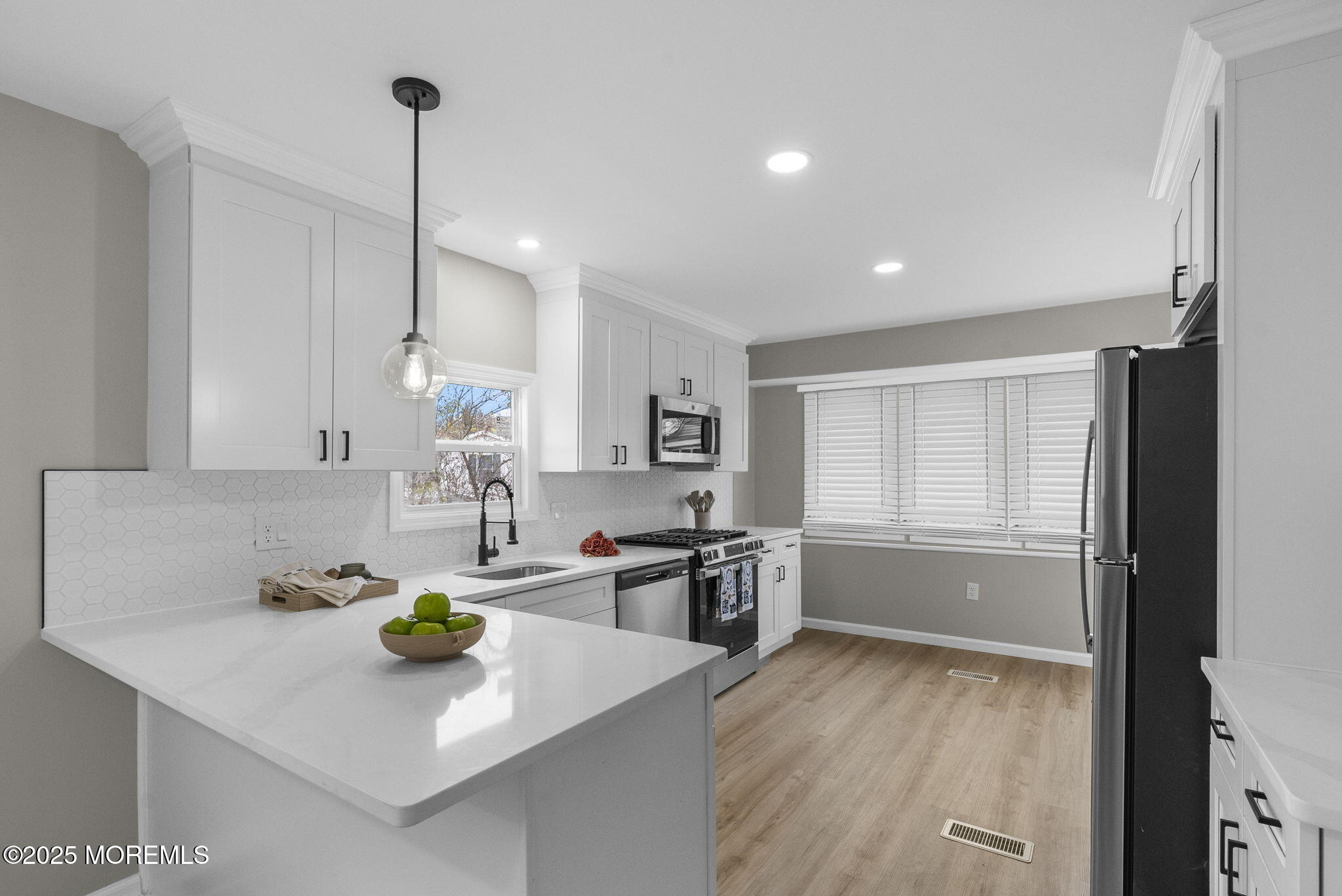 712 7th Street Jackson, NJ 08527 - Photo 7 of 37 a kitchen with stainless steel appliances granite countertop a sink a stove and a refrigerator