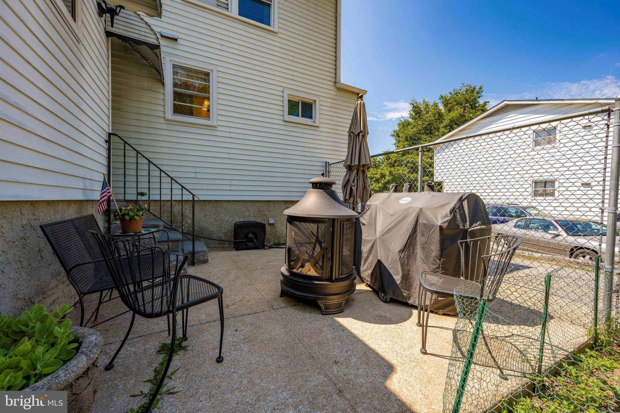 4304 Ridge Avenue Baltimore, MD 21227 - Photo 38 of 50 a view of a patio with couple of chairs