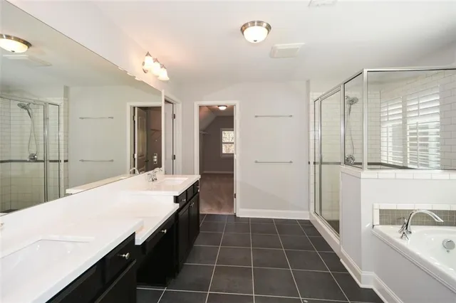 a bathroom with a granite countertop toilet sink and shower