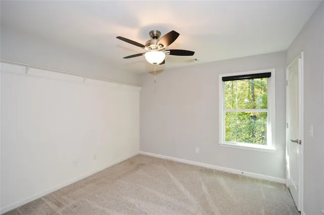 a view of a swimming pool with a lawn chairs