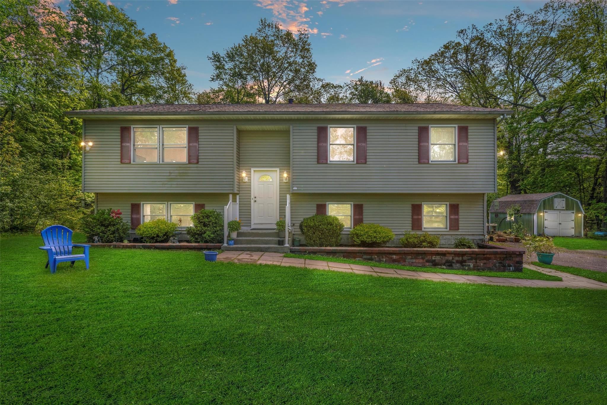 220 Twin Arch Road Washingtonville, NY 10992 - Photo 1 of 1 a front view of a house with a garden and yard
