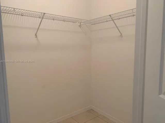 a view of a kitchen counter top a sink and dishwasher in a kitchen