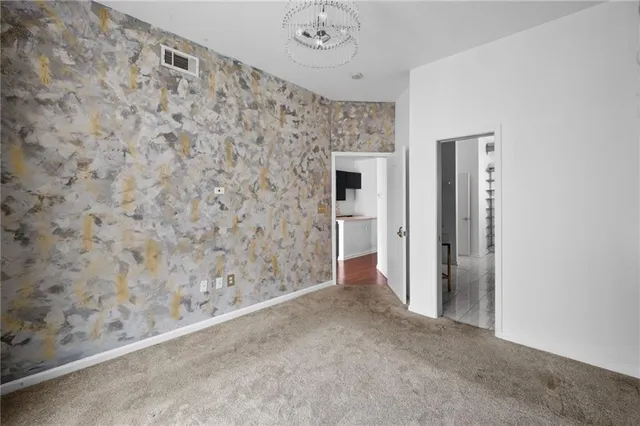 a view of empty room with a fireplace