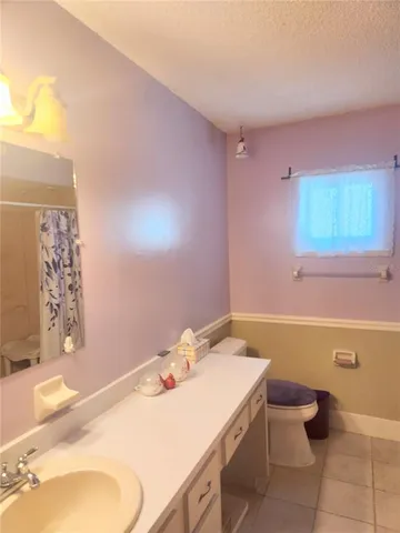 a bathroom with a sink toilet and tub