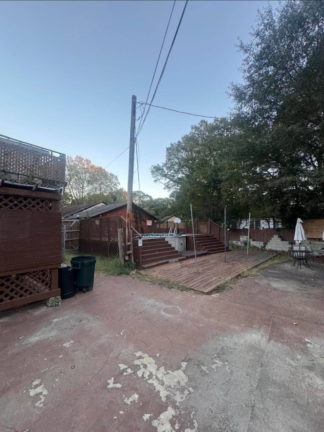1497 Titus Road Memphis, TN 38111 - Photo 11 of 13 a view of a yard with car parked