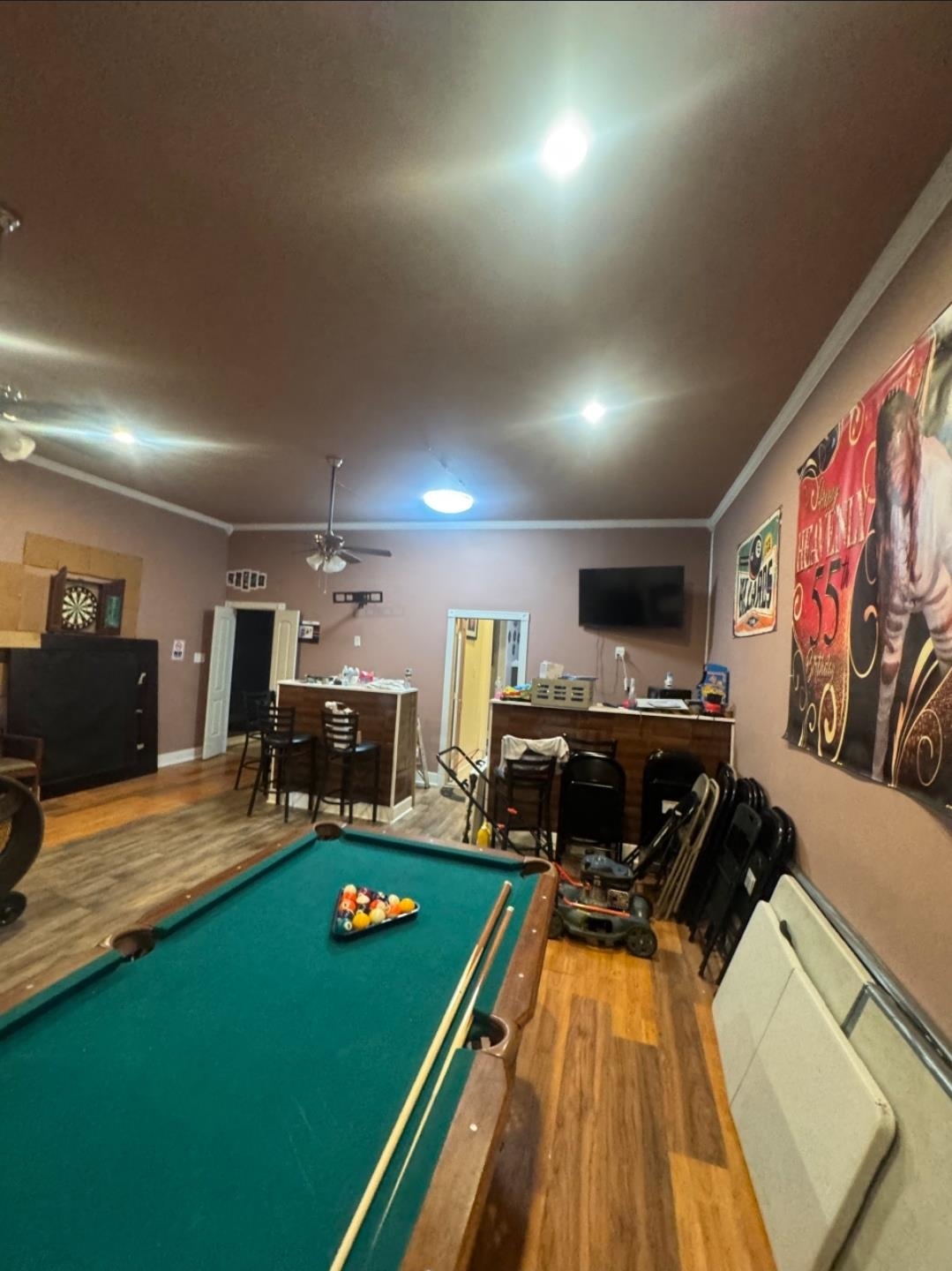 1497 Titus Road Memphis, TN 38111 - Photo 11 of 13 a living room with furniture pool table and a flat screen tv