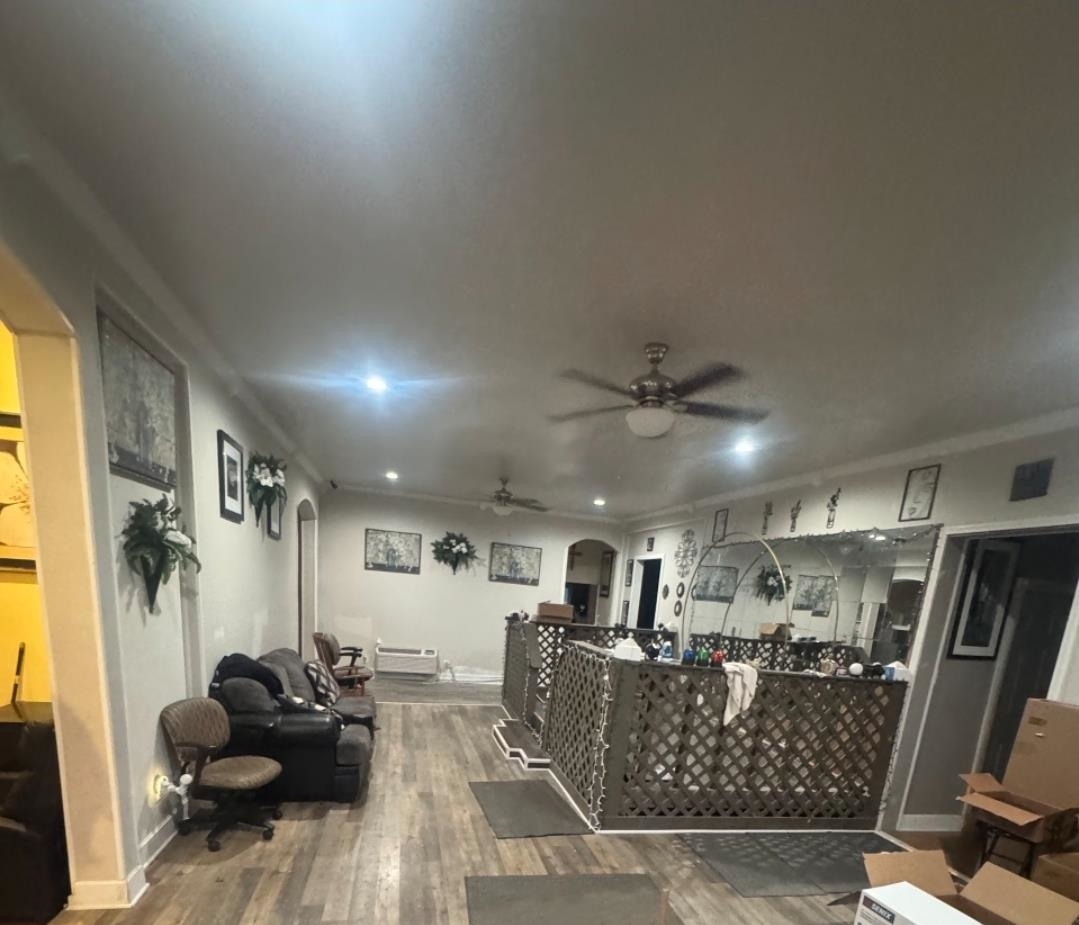 1497 Titus Road Memphis, TN 38111 - Photo 12 of 13 a view of a livingroom with furniture and a ceiling fan