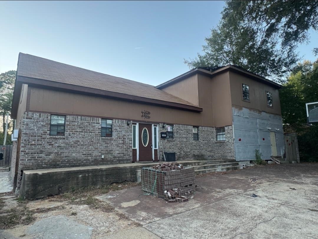 1497 Titus Road Memphis, TN 38111 - Photo 2 of 13 a front view of a house with a yard