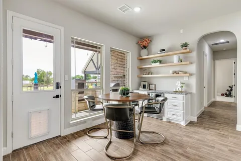 a work room with furniture and wooden floor