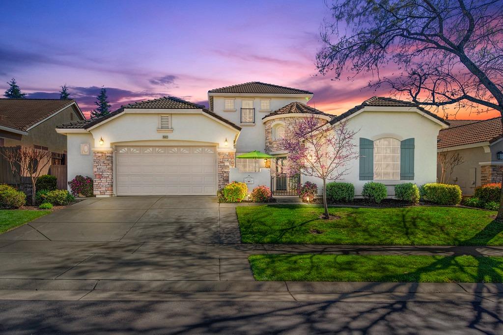 Love this picture showcasing the great curb-appeal with gated front entry and expanded 2 car garage.