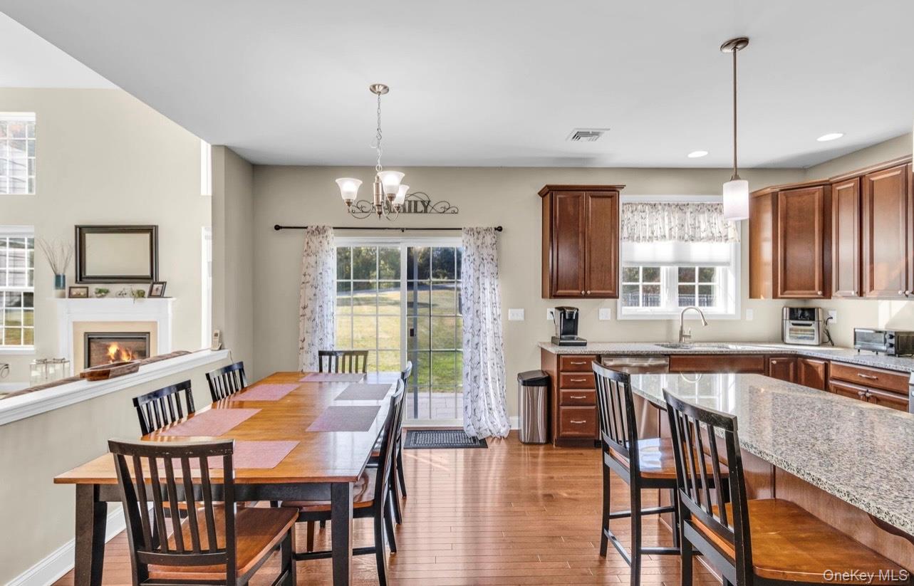 59 Luthien Forrest Road Rock Tavern, NY 12575 - Photo 11 of 48 a view of a dining room with furniture window and wooden floor