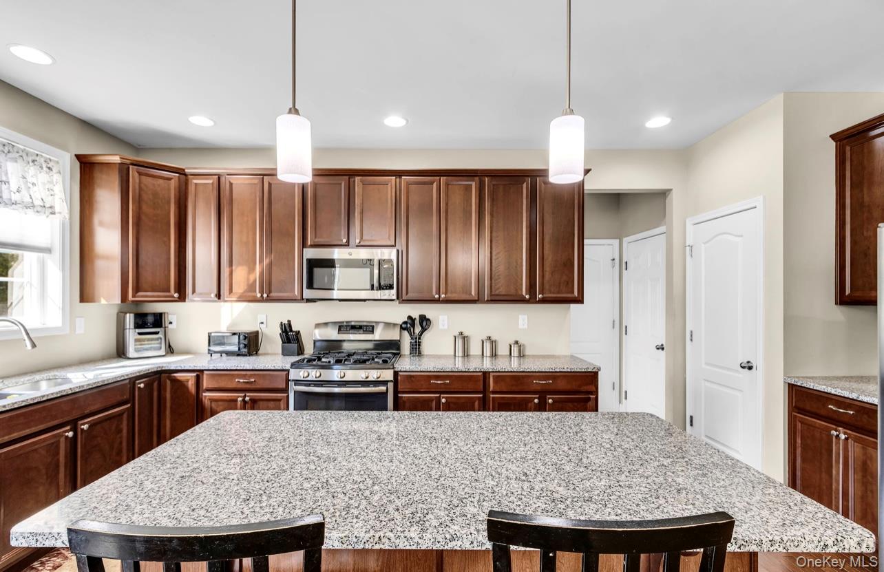 59 Luthien Forrest Road Rock Tavern, NY 12575 - Photo 12 of 48 a large kitchen with a table and chairs