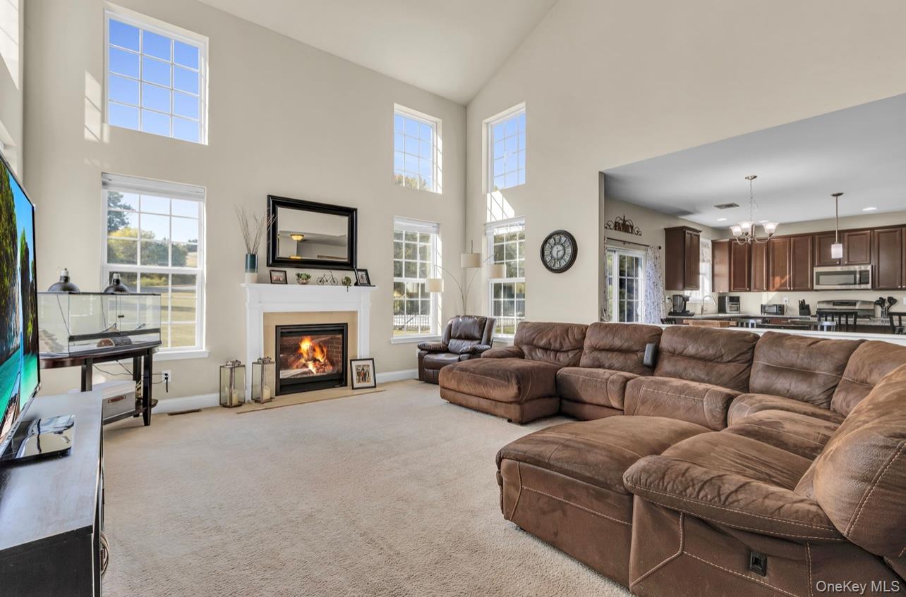 59 Luthien Forrest Road Rock Tavern, NY 12575 - Photo 17 of 48 a living room with furniture and a fireplace