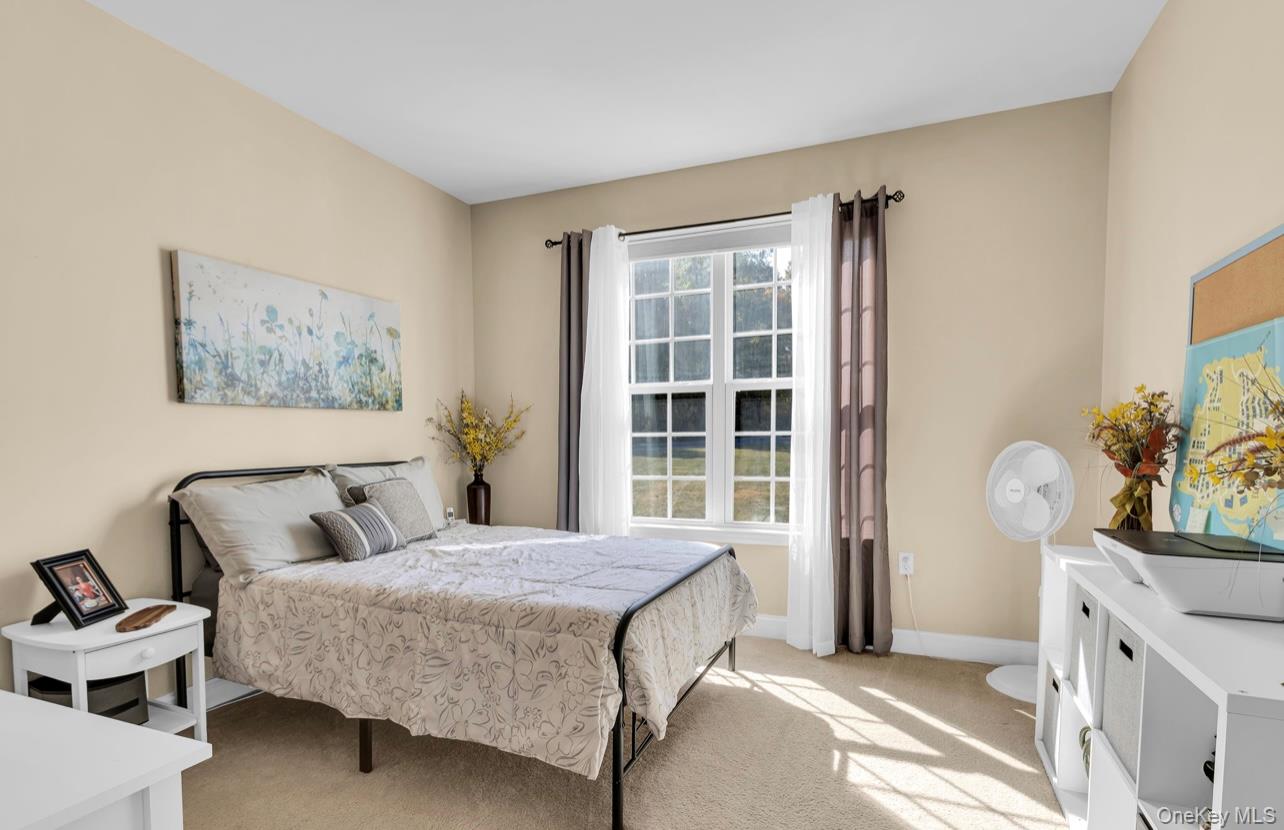 59 Luthien Forrest Road Rock Tavern, NY 12575 - Photo 18 of 48 a bedroom with a bed and a dresser