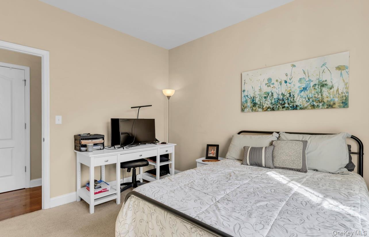 59 Luthien Forrest Road Rock Tavern, NY 12575 - Photo 19 of 48 a bedroom with a bed and a flat screen tv