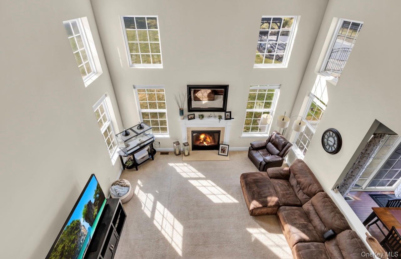 59 Luthien Forrest Road Rock Tavern, NY 12575 - Photo 23 of 48 a living room with furniture and a fireplace
