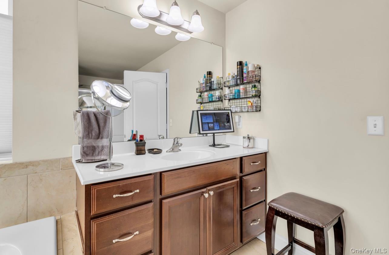 59 Luthien Forrest Road Rock Tavern, NY 12575 - Photo 31 of 48 a bathroom with a sink and a mirror