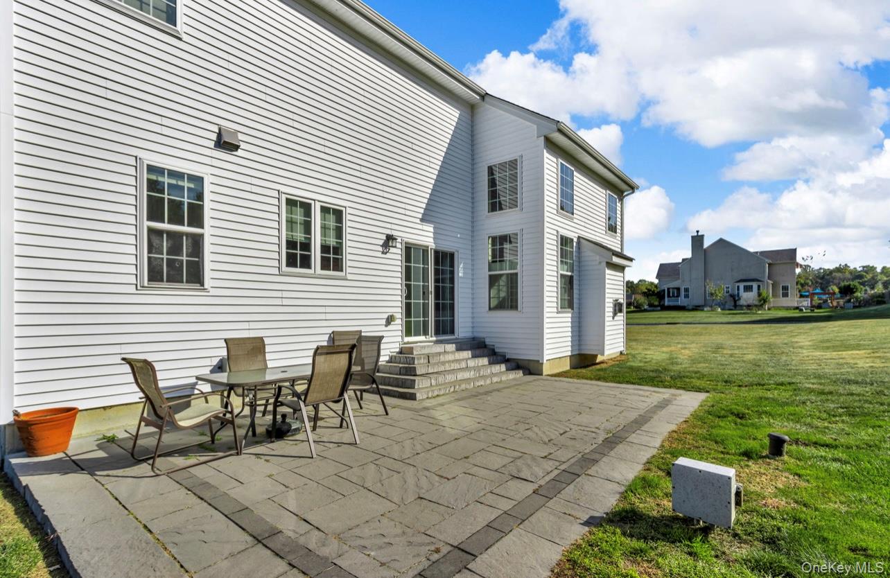 59 Luthien Forrest Road Rock Tavern, NY 12575 - Photo 39 of 48 a view of a patio with table and chairs and potted plants