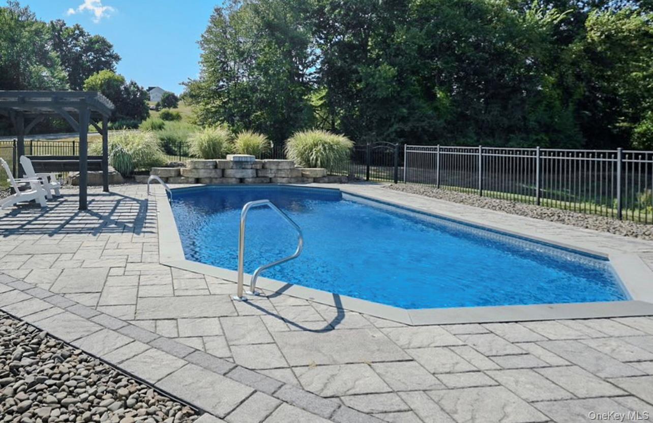 59 Luthien Forrest Road Rock Tavern, NY 12575 - Photo 43 of 48 a view of a backyard with sitting area
