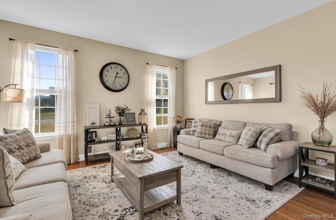 59 Luthien Forrest Road Rock Tavern, NY 12575 - Photo 6 of 48 a living room with furniture and a large window