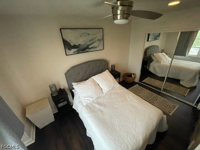 2350 West First Street, Unit 603 Fort Myers, FL 33901 - Photo 10 of 17 a bedroom with a bed and wooden floor