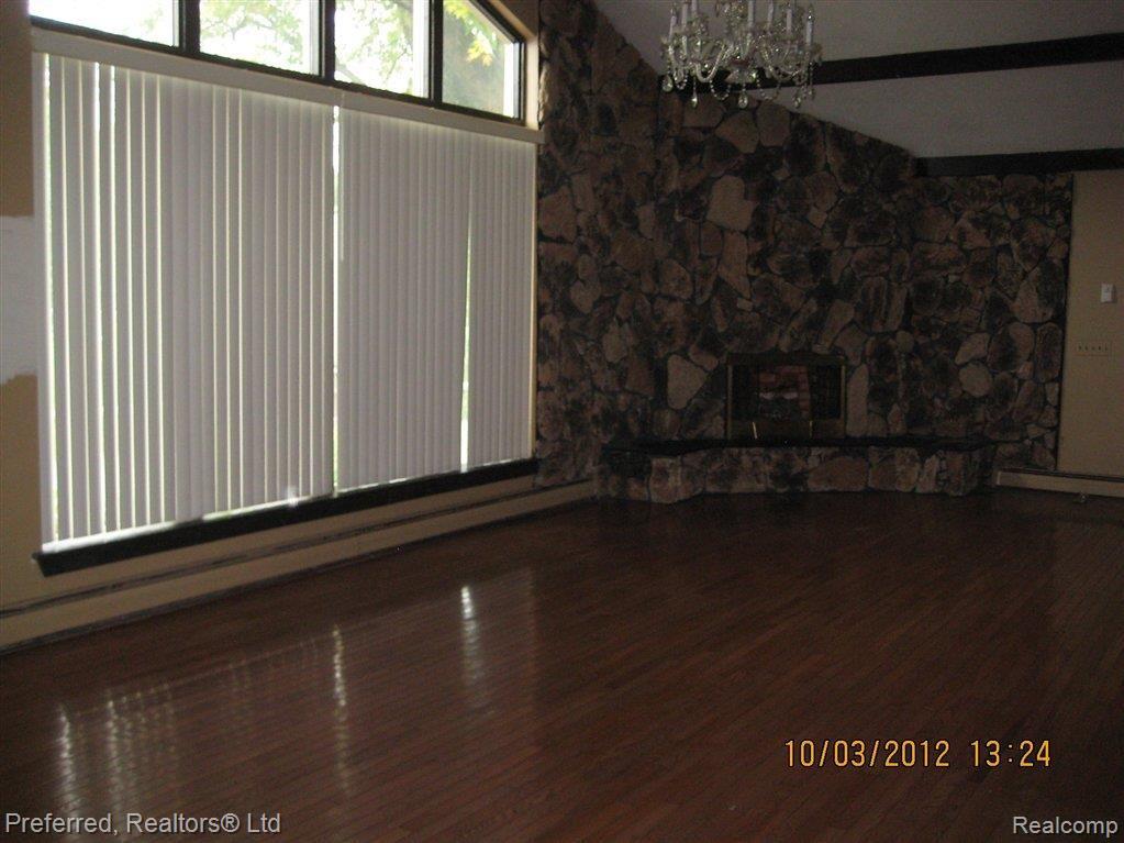15475 Haggerty Road Belleville, MI 48111 - Photo 8 of 14 family room fireplace